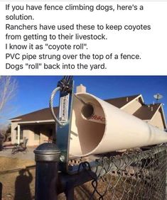 a white cone sitting on top of a fence next to a black fire hydrant