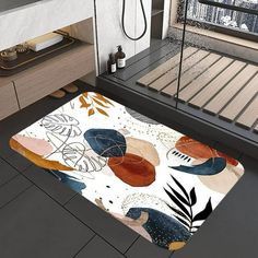 a bathroom area with a rug on the floor