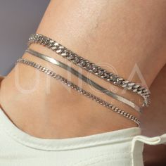 a) Snake chain anklet - 3mm b) Curb chain anklet - 3mm c) Curb chain anklet - 6mm These waterproof chain anklets will be your new fave staple all season long. high quality waterproof anklets, lead free, hypoallergenic ankle brecelet★ --------------------------------- ► PRODUCT DETAILS * Hypoallergenic Stainless Steel * This piece is WATERPROOF * Won't turn skin green * Won't irritate skin * Also unlike Sterling Silver, DOESN'T TARNISH --------------------------------- ► PACKAGING / GIFT BOX All jewelry is carefully packed in our signature UNIQA boxes. To reduce waste, we often put an order with multiple pieces in one or two gift boxes. If you would like your order to be boxed separately or if only part of your order is intended as a gift, please leave a note at checkout and we'll be happy Minimalist Metal Bracelets For Summer, Summer Minimalist Metal Bracelets, Adjustable Trendy Metal Anklets, Trendy Adjustable Metal Anklet, Adjustable Chain Bracelet For Summer, Adjustable Summer Chain Bracelet, Summer Gift Adjustable Chain Bracelet, Adjustable Chain Bracelets For Summer, Trendy Adjustable Delicate Chain Anklet