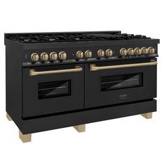 a black and gold stove top oven with four burners on each side, in front of a white background