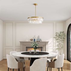 a dining room table with white chairs and a chandelier hanging from the ceiling