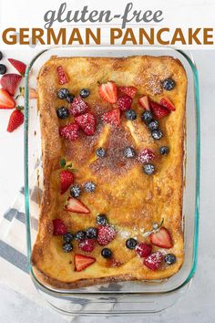 a casserole dish filled with fruit and topped with powdered sugar on top