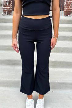 These yoga pants feature a wide yoga waistband, high rise, wide flared hem, ribbed detailing, and a pocket built into waistband on the back. 75% Nylon 25% Spandex Hand wash cold, separately.Do not bleach. Hang dry. Do Not Iron. Madison is 5’8“ wearing a size Small.Model measurements:Bust: 32 in.Waist: 24 in.Hip: 34 In. Casual Flared Activewear For Yoga, Black Wide Leg Elastane Yoga Pants, Casual Flare Stretch Yoga Pants, Black Flared Bottoms With Pockets, Black Flare Bottoms With Pockets, High Waist Yoga Pants With Ribbed Waistband, High Waist Yoga Pants With Ribbed Waistband For Athleisure, Black Full-length Yoga Pants With Comfort Waistband, Black Wide Leg Yoga Pants With Comfort Stretch