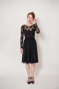 Black jersey dress with a fine, fluffy tulle skirt, with a noble lace top and classic heart cutout. length ca. 100 Material 66% viscose, 30% polyamide, 4% elastane Elegant Fit And Flare Dress With Lace Bodice, Spring Gala Midi Dress With Lace Trim, Fitted Sheer Lace Mesh Dress, Sheer Lace Fitted Mesh Dress, Party Lace Midi Dress With Stretch, Party Lace Stretch Midi Dress, Fitted Lace Dress With Lace Sleeves For Gala, Spring Gala Evening Dress With Lace Bodice, Lace Trim Dress For Gala In Spring