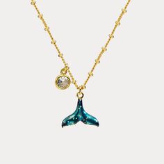 Do you like mermaid tail jewelry? Do you want a 18k gold chain? Just get Mermaid Tail Necklace, a piece of natures jewelry. This is a special necklace from Selenichast jewelry store. Get your tail to the beach with this Mermaid Tail Necklace. This necklace features a hand-enamelled mermaid tail in the centre and a gemstone suspended from the chain. Each elements has been carefully hand curved and adorned to bring the lovely creature to life. Why not wear it and show everyone your connection to t Elegant Mermaid Jewelry With Lobster Clasp, Ocean-inspired Charms Necklaces For Gifts, Ocean-inspired Charms Necklace As Gift, Ocean-inspired Charms Necklace For Gift, Mermaid Charm Necklace With Lobster Clasp For Gift, Mermaid Tail Necklace, Necklace Gift Ideas, Diamond Evil Eye, Talisman Necklace