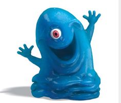 a blue figurine with red eyes and hands on it's legs, sitting in front of a white background