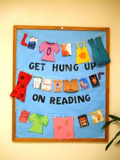 a bulletin board with clothes hanging on it and the words get hung up on reading