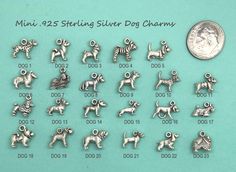 silver dog charms are displayed on a blue background with a dime for the price tag