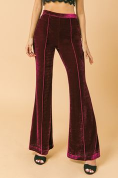 A high waisted flared velvet pant with pin tuck detail Details Self: 95% Polyester, 5% Spandex Size & Fit - Model is 5`8" and wearing size Small - Measurements taken from size Small - Length: 43" 70s Pants, Velvet Pant, 2024 Board, Velvet Flare Pants, Outfits 70s, Velvet Flares, Georgette Tops, Fashion Vocabulary, High Waisted Flares