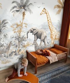 a baby is playing on the floor in front of a wall mural with zebras and giraffes