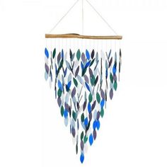 a wind chime hanging from the ceiling with blue and green leaves on it's side