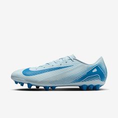 a white and blue nike soccer shoe on a white background with the word nike written in blue