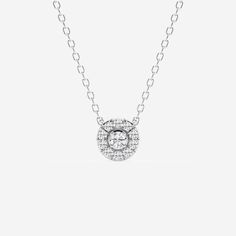 Pay homage to the flower power movement of the 60s with this beautiful floral-inspired round diamond pendant. A central round diamond is encased in a pave outer circle, creating a stunning petal effect. Ideal for layering or wearing on its own, this gorgeous floral-inspired diamond pendant radiates with elegance and femininity. Halo Necklace, Halo Pendant, Round Moissanite, Engagement Ring Wedding Band, Diamond Halo, Exquisite Jewelry, Moissanite Diamonds, Perfect Ring, Halo Diamond