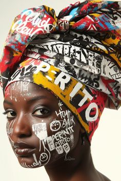 a woman with graffiti painted on her face and head scarf around her neck, wearing a turban