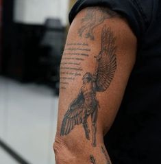 a man with a tattoo on his arm