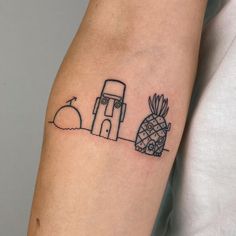 a small tattoo on the arm of a person with a pineapple and an rv