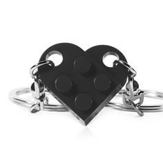 two black heart shaped rings on each other