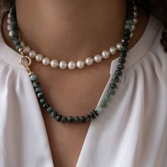 "This beautiful natural emerald necklace is handknotted with green silk cord. The beads are approx 8mm and have a natural shape to them. Not each bead is uniform which makes this necklace have character. The clasp is made with 14k solid gold. This necklace is a great staple piece. Easy to throw  on over a white blouse or T-shirt - great for day or night.   Details: ✦Natural emerald gemstones ✦14k solid gold clasp ✦ Necklace measures 20 inches ✦Handknotted with silk cord ✦Packaged in our elegant black Vivien Frank Box ✦Hallmarked with jewelers stamp and 585 (14k) ✦ Pearl necklace (in first image) can be found here https://www.etsy.com/listing/1592853266/ If you have any questions about this necklace, just hit the \"Ask a Question\" button next to the price and we will get back to you within Elegant Beaded Necklace With May Birthstone Gemstone, Elegant Beaded Necklace With May Birthstone, Elegant May Birthstone Beaded Necklaces, Gift Emerald Necklace Single Strand Jade, Elegant Emerald Beaded Necklaces, Elegant Hand Knotted Beaded Necklaces For Gifts, Elegant Hand Knotted Beaded Necklace Gift, Elegant Hand-knotted Beaded Necklaces For Gifts, Emerald Beaded Necklace Single Strand As Gift