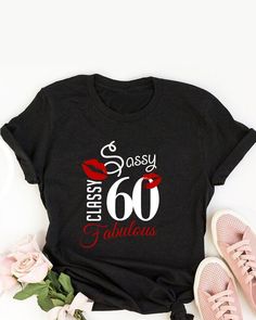 a black shirt that says classy 30 fabulous with red lipstick on it and some flowers