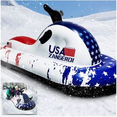 an inflatable boat with the american flag painted on it is floating down a snowy hill