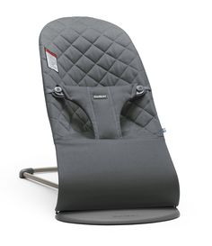 a grey baby seat with buttons on the front and back side, sitting in an upright position