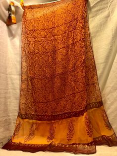 Very large 19 x 72 hand made in India 100% viscose chiffon beautiful sheer orange fabric with leaf pattern very delicate spun sheer made by Sevya shawl scarf or wrap Mint condition Free shipping in us Email me with any questions thank you for looking and check out my other unusual, unique items or necessary craft supplies. Traditional Sheer Silk Chiffon Dupatta, Festive Sheer Chiffon Dupatta, Silk Shawl With Sheer Dupatta, Silk Sheer Dupatta Shawl, Summer Bohemian Georgette Dupatta, Bohemian Georgette Dupatta For Summer, Elegant Orange Silk Dupatta, Traditional Sheer Georgette Dupatta, Bohemian Orange Silk Dupatta