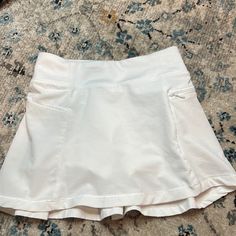 White Tennis Skirt For Girls. In Brand New Condition From A Smoke And Pet Free Home. White Fitted Tennis Skirt With Pockets, White Tennis Skirt With Built-in Shorts For Cheerleading, Sporty White Tennis Skirt With Go-dry, White Moisture-wicking Tennis Skirt For Sports, White 4-way Stretch Tennis Skirt, White Tennis Skirt, Tennis Skirt, Kids Bottoms, Tennis