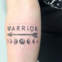 a woman with a tattoo on her arm that says,'warrior'and an arrow