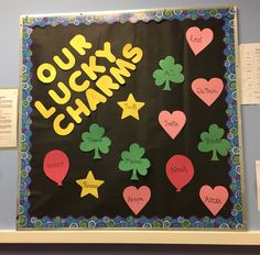 a bulletin board with lots of shamrocks on it and the words lucky charms written in large letters