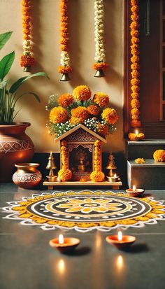 an arrangement of flowers and candles in front of a small shrine on a table with decorations