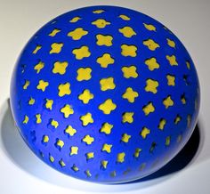 a blue ball with yellow stars on it