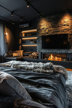 a living room filled with furniture and a fire place next to a wall mounted tv