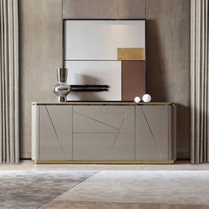 a white and gold sideboard in a room