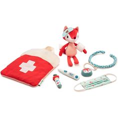 a red and white stuffed animal next to medical supplies