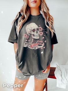 Skull Sushi T-shirt | Japanese Dream T Shirt This is a DTG (Direct to Garment) print, not Vinyl or sublimation. The design is printed directly on the shirt with garment ink. HOW TO ORDER?: Placing an order is simple! Please review all images in this listing for style, color and sizes. - Select the size and color of the shirt from the drop-down menus. - Select the quantity - Fill in the customization (if required) - Add to cart - Proceed to checkout ------------------------------ COLOURS: White I Spooky Skull Print T-shirt For Streetwear, Spooky Black T-shirt With Skull Print, Edgy Tops With Halloween Front Print, Edgy Relaxed Fit T-shirt With Skull Print, Edgy Tops With Front Print For Halloween, Relaxed Fit Skull Print Graphic Tee, Relaxed Fit Graphic Tee With Skull Print, Black Short Sleeve T-shirt With Skull Print, Alternative Halloween Crew Neck T-shirt