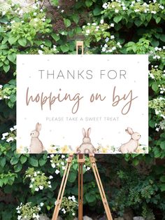 a sign that says thanks for hopping on by with bunnies and flowers in the background