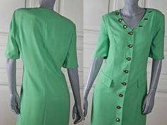 This German vintage green dress has a V neckline, and closes in the front with eight black and gold buttons. Three more of these buttons are decorative and are positioned on the right side of the V neckline, with three imitation black buttonholes on the left side of the V neckline. This stunning slimline knee-length dress has two imitation flap hip pockets. The summer dress has padded shoulders and short sleeves. The high-quality dress is fully lined in green 100% acetate material. Brand label: Elegant Green Dress With Button Closure, Classic Green Dress With Buttons, Classic Green Dress With Button Closure, Green Short Sleeve Dress With Buttons, Green Button-up Dress With Button Cuffs, Green V-neck Dress With Buttons, Vintage Green Dress, Country Dresses, Sleeveless Dress Summer