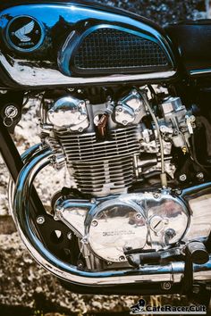 the front end of a motorcycle parked on some rocks