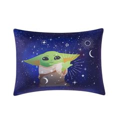 a pillow with an image of baby yoda holding a wand in the night sky