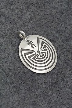 This sterling silver pendant was made by Navajo silversmith Stanley Gene. The back is signed SG and stamped sterling.Length: 1 1/4"Width: 1 1/8"Free shipping on all orders! We ship with USPS and always include tracking. All orders ship within a day of payment.Returns are accepted up to 30 days after you receive your order. Just send us a message. Our shop offers cash back or store credit. The item must be returned in new condition. Sterling Silver Pendant, Sterling Silver Pendants, Silver Pendant, Stamp, Sterling Silver, Pendant, Free Shipping, Silver