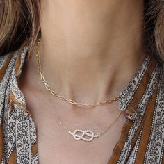 "Feminine and beautiful Large infinity knot diamond necklace  in the video this necklace is the large knot diamond necklace.     D E T A I L S : ♥ Natural diamonds, conflict-free, 0.95 carat, F color, VS clarity. ♥ Gold: 14K solid gold. Yellow gold,  white gold or rose gold. ♥ Pendant size: 30mm. ♥ Chain Length: 42cm chain. Please select your wanted chain length and gold color in the drop-down menu. ♥️♥️♥️ Service ♥️ Free IGL Jewelry Certificates: including evaluation for insurance; the certificate is free of charge if you request it when placing your order. (Takes additional two business days). ♥️ Lead time: please allow 3-5 weeks; all items are handmade per order. ♥️ Free Shipping: This item is shipped with express shipping within 3-5 business days at no extra charge. ♥️ Luxury packaging Pendant Necklace White Gold, Necklace Diamond Pendant, Celtic Knot Jewelry, Knot Jewelry, Necklace Infinity, Necklace White Gold, Infinity Knot, Jewelry Knots, Necklace Love