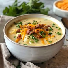 a white bowl filled with cheese and bacon soup