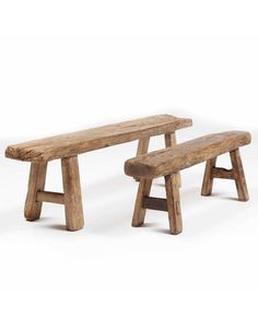 two wooden benches sitting next to each other