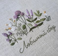 embroidered flowers on linen with the words'nourivir hope'written in cursive writing