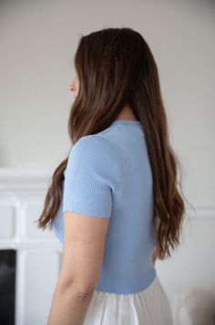 This light blue ribbed fitted top is the perfect addition to any wardrobe. With a fitted design, it pairs perfectly with high waisted pants and skirts. The round neckline and perfect fit offer both comfort and style. round neckline ribbed fabric fitted true to size 90% rayon 10%nylon hand wash cold model is wearing a small Blue Fitted Short Sleeve Top With Crew Neck, Ribbed Stretch Short Sleeve Top, Blue Fitted Crew Neck Short Sleeve Top, Blue Workwear Top With Ribbed Neckline, Fitted Blue Short Sleeve Crew Neck Top, Fitted Blue Crew Neck Short Sleeve Top, Blue Fitted Top With Ribbed Neckline, Blue Ribbed Top With Relaxed Fit, Chic Fitted Blue T-shirt