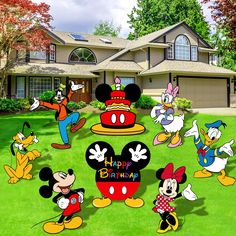 mickey mouse birthday yard decorations in front of a house