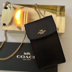 Coach Black Crossbody Bag With Gold Strap. Brand New! Snap Closure. Style F89282. Strap With 33” Drop Wear As A Crossbody Or A Shoulder Bag. 4 1/4” Long X 7” High X 1 1/4 Width. Comes With Coach Gift Box. All Sales Are Final. Coach Crossbody Wallet For Travel, Classic Bags With Chain Strap, Classic Bag With Chain Strap, Classic Bag With Chain Strap As Gift, Luxury Black Phone Bag For Everyday Use, Classic Chain Strap Bag As Gift, Classic Chain Strap Bag, Elegant Crossbody Phone Bag With Chain Strap, Classic Formal Phone Bag With Removable Pouch