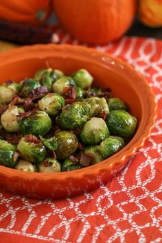 a bowl filled with brussel sprouts on top of a table