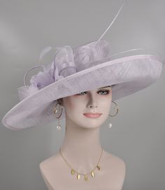 "https://www.youtube.com/shorts/0SWUprbeWfw With my little son's help, I finished the video on Youtube, it is very hard for the people to get a right size hat due to the big head size, please check the video, it will help you.  Description: This beautiful sinamay hat is an elegant wear at any church or derby event. its sinamay material is not too intimidating and attracts the eye. The chic flower adnorment that rests on the wide, side sweep brim is complemented by sinamay accentuations. Material: Sinamay with feathers Crown Width; 8 inch Crown Height: 4 inch Brim Width: 18 inches Head girth is from 22' to 23.22 \" adjustable size fits  most with an adjustable cord strap for the smaller fit If you need to  some colors on the hat to match your dress, please let me know Color on screen may va Elegant Sinamay Fascinator For Formal Occasions, Elegant Sinamay Hats For Church, Elegant Sinamay Fascinator With Wide Brim, Elegant Wide Brim Sinamay Fascinator, Formal Sinamay Mini Hats For Royal Ascot, Lavender Mini Hats For Kentucky Derby Formal, Lavender Mini Hat For Royal Ascot Formal Event, Elegant Purple Fascinator For Church, Lavender Fascinator For Wedding At Royal Ascot