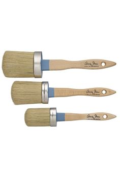 three paint brushes with blue bristles on them